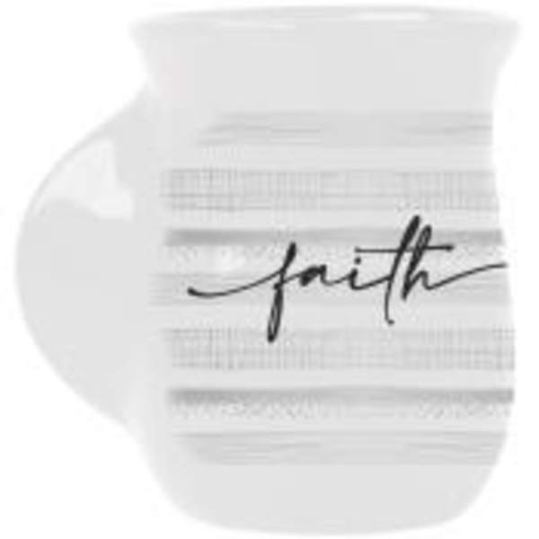 White round decorative object with the word "faith" in black script