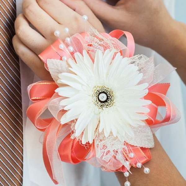 White gerbera daisy corsage with pink ribbon and pearl accents