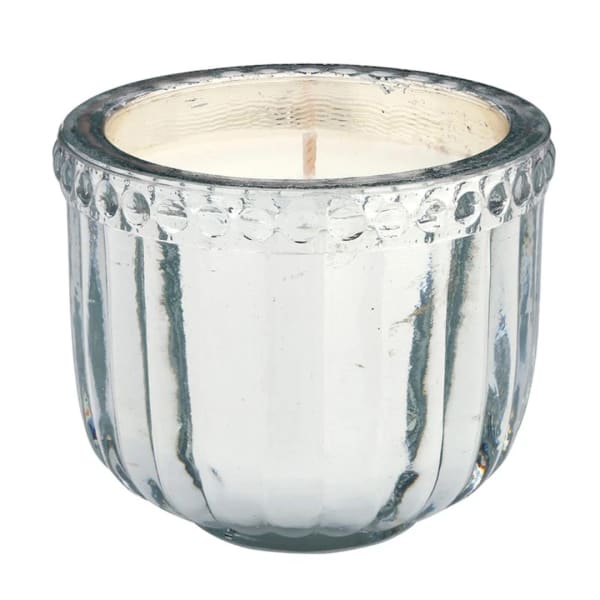 Clear glass candle holder with a white candle inside