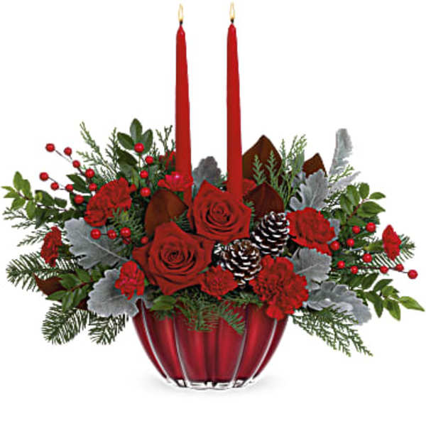 Red roses and carnations in a red vase with two red candles