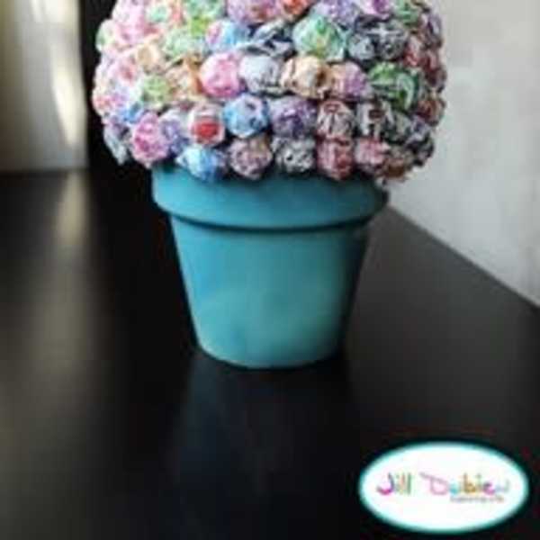 Colorful bouquet of small flowers in a blue pot
