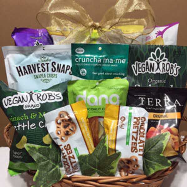 Basket of assorted snack bags tied with a gold bow
