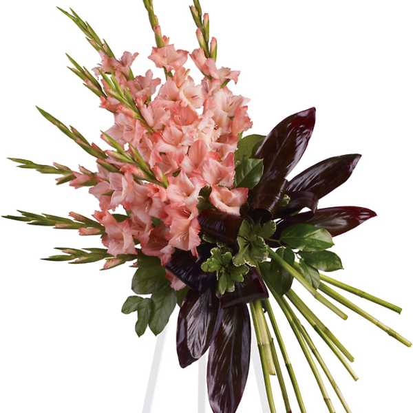 Pink gladiolus arrangement on a white easel stand