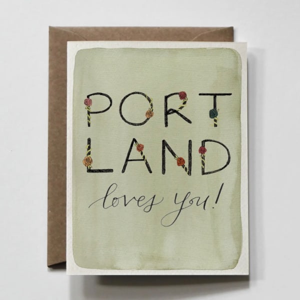 Greeting card with the words "PORTLAND loves you!" on a brown envelope