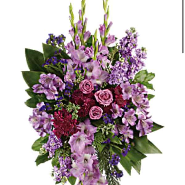 Standing floral spray with pink roses and purple flowers