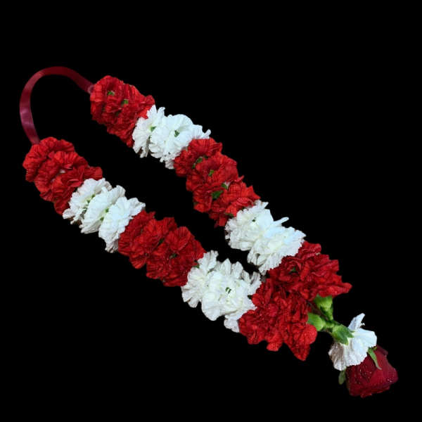 Red and white floral garlands with a red rose accent