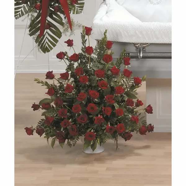 Large arrangement of red roses in a white vase