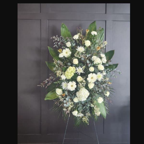 Standing white floral spray on an easel