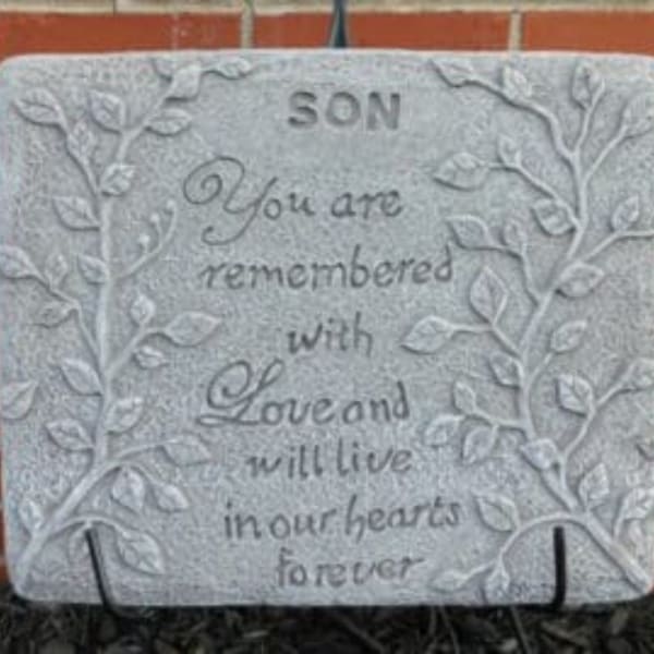 Memorial stone engraved with the words "SON" and a remembrance message