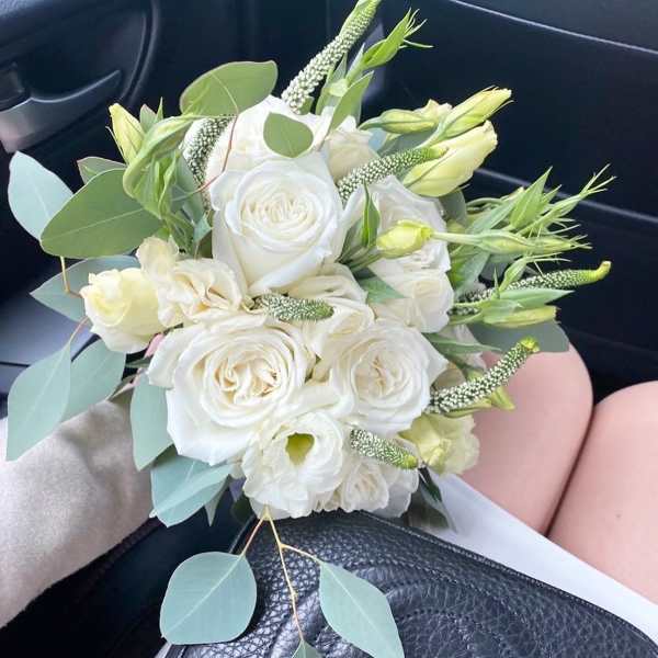 White rose bouquet with pale green accents and eucalyptus