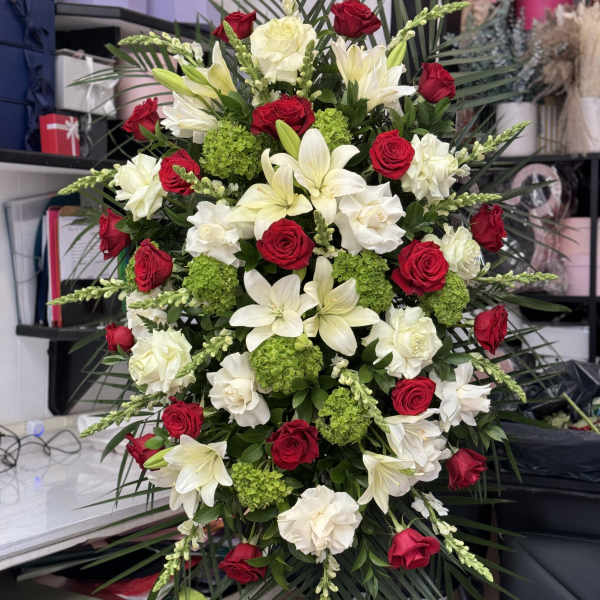 Large red and white floral spray with lilies and roses