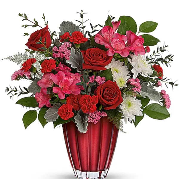 Red and pink mixed bouquet in a red vase