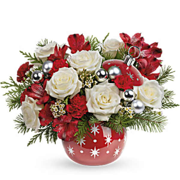 Red and white roses in a red ornamented vase