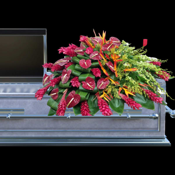 Casket spray with pink and orange tropical flowers