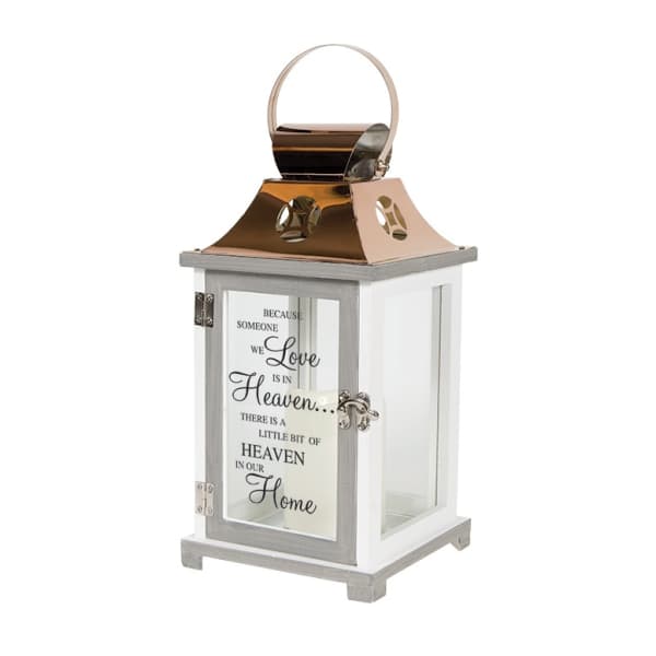 Decorative white lantern with a memorial quote on the front