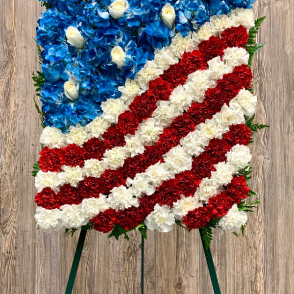 Patriotic floral easel spray with blue, white, and red flowers