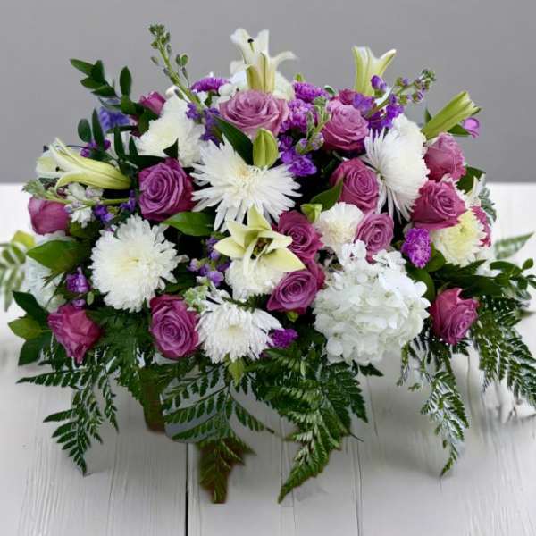 Bouquet of pink roses, white lilies, and white chrysanthemums