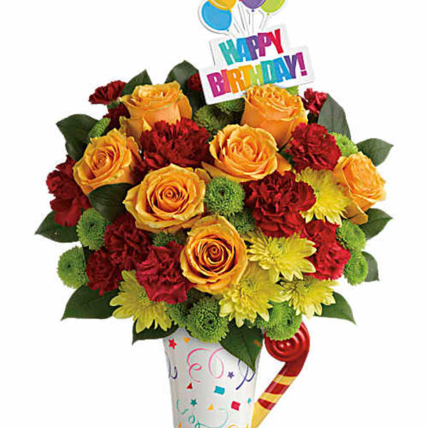 Birthday bouquet of yellow roses, red carnations, and chrysanthemums with a party topper