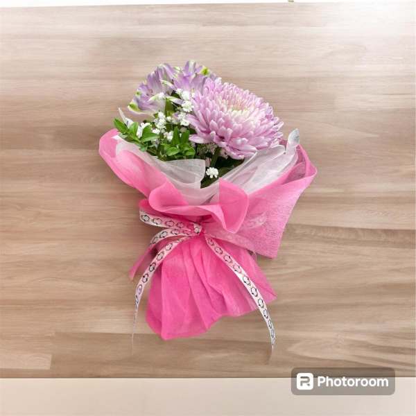 Pink and lavender bouquet wrapped in bright pink paper