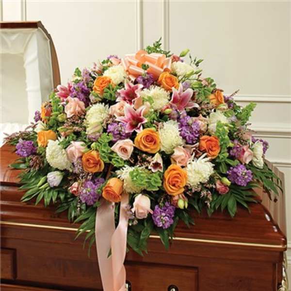 Large floral casket spray with pink, orange, white, and purple blooms