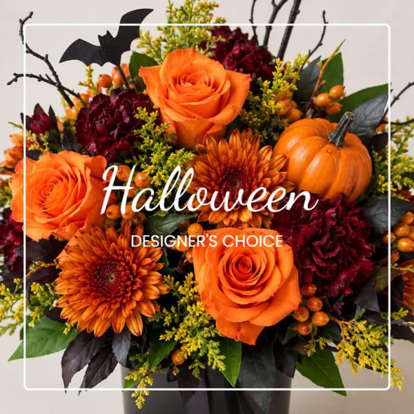 Halloween bouquet with orange roses, orange mums, and a small pumpkin
