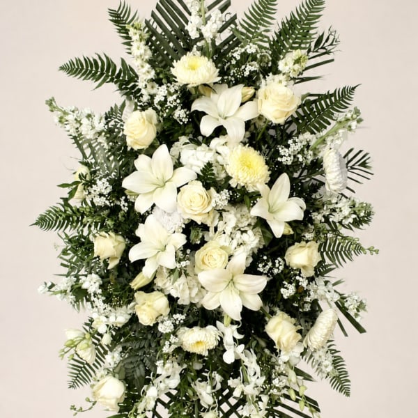 White floral standing spray with lilies and roses