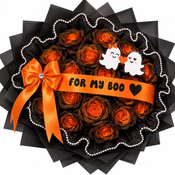 Orange roses in a black wrapped bouquet with an orange ribbon and ghost topper