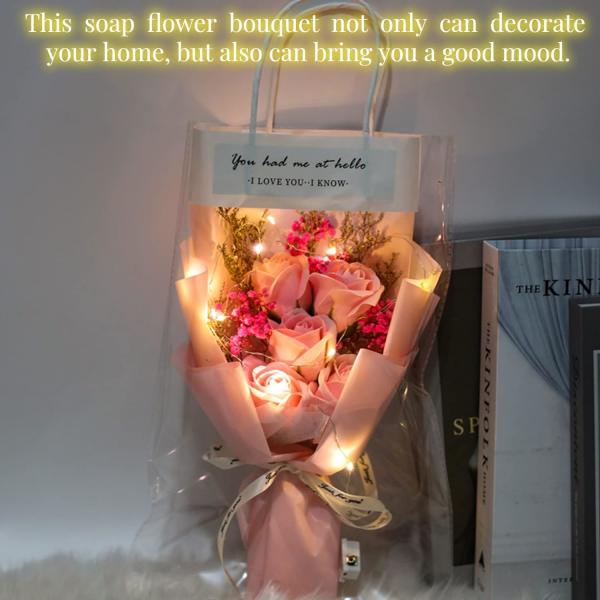 Pink rose bouquet wrapped in pastel paper with string lights