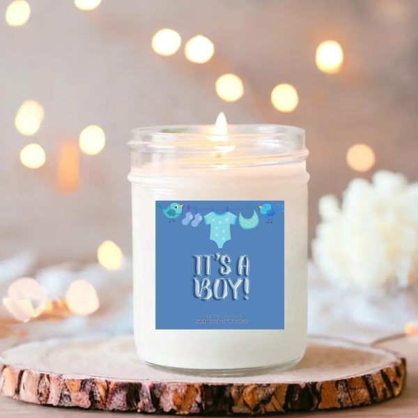 White candle in a glass jar with a blue "It's a Boy!" label