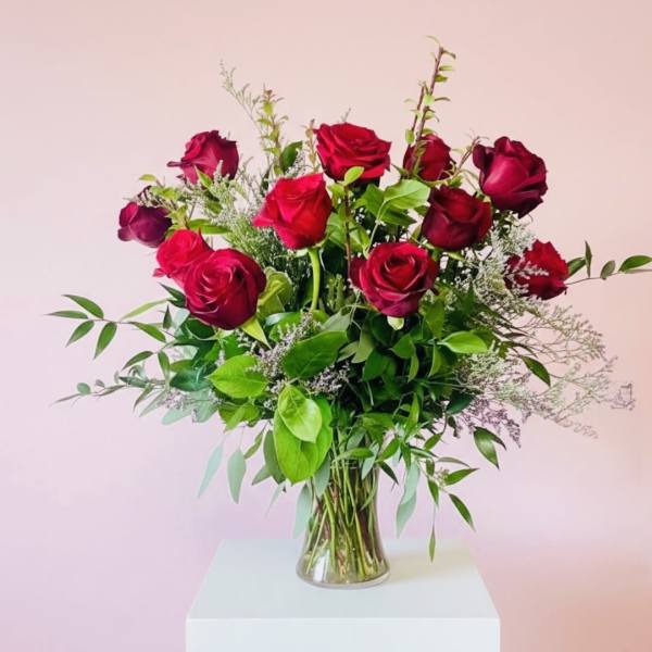 Bouquet of red roses in a clear glass vase