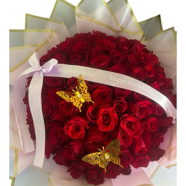 Red rose bouquet with birthday ribbon and butterfly decorations