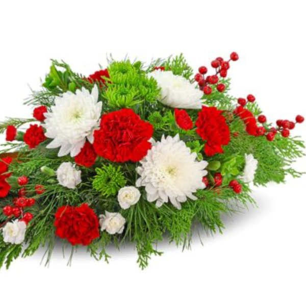 Red and white floral arrangement with berries and greenery