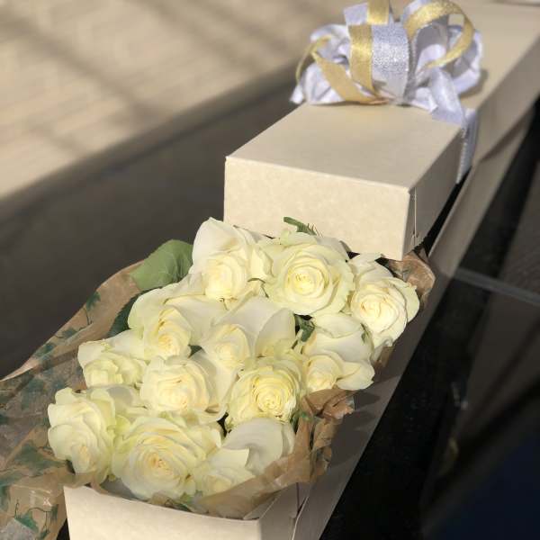 12 long stem White roses in a box