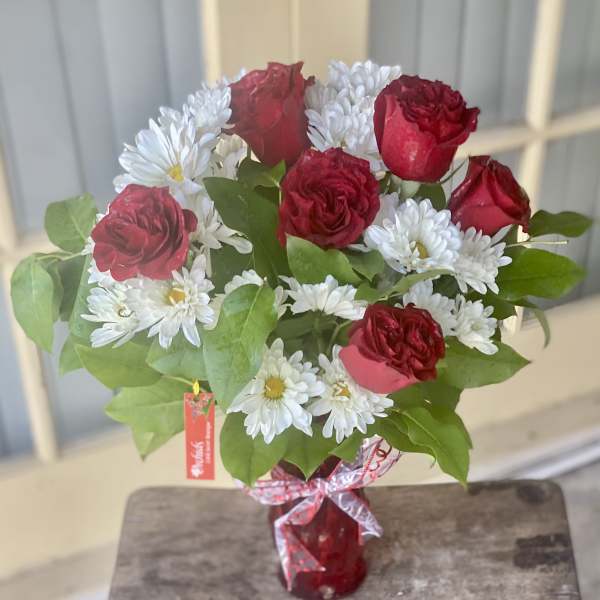 Daisies & Short Stem Red Roses In A Red Vase