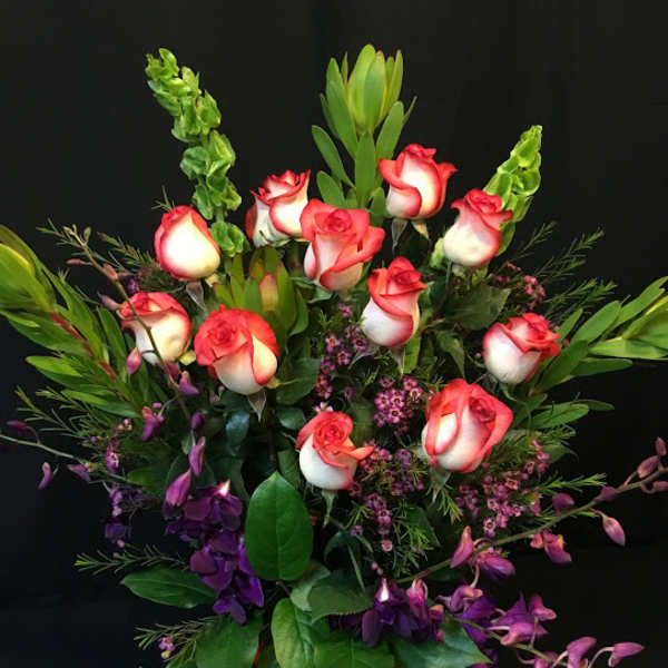 Dozen roses plus orchids