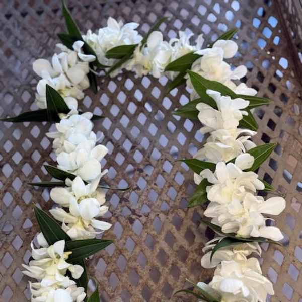 Single white orchids lei, with greens