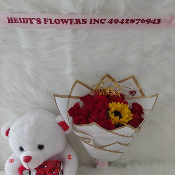 12 roses ,a sunflowers, a beautiful teddy bear, and chocolates.