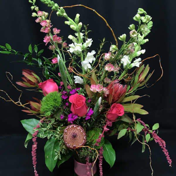 Wild romance bouquet with roses and protea