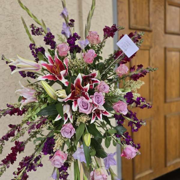 Violet memorial standing funeral spray