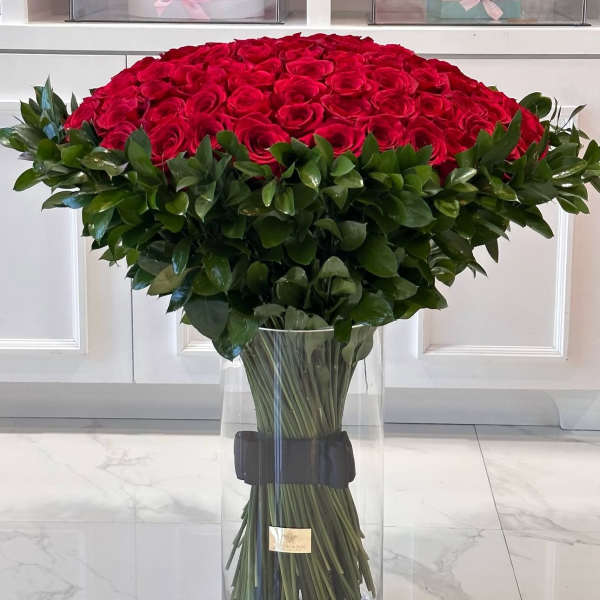 200 red roses with greens and vase