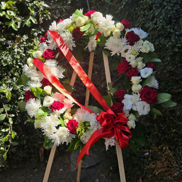 Red and white standing funeral wreath