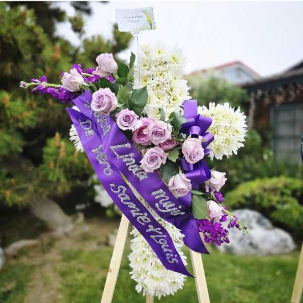 Purple and white standing funeral cross