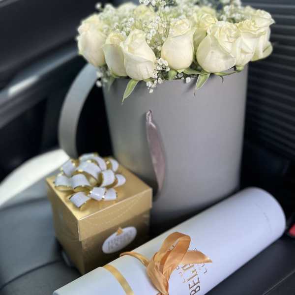 White roses, and baby breath in a luxurious grey box