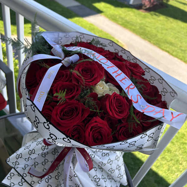 Red roses with Dior ribbons