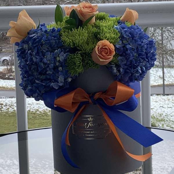 Blue hydrangeas, orange roses by lav.ishbouquets