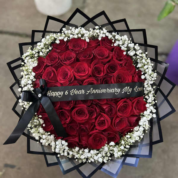 50 Red Roses w/ baby’s breath trim