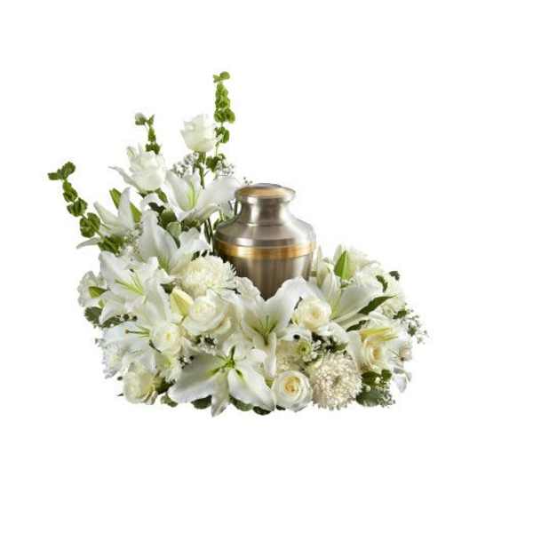 White lily and rose cremation urn wreath with a metal urn in the center