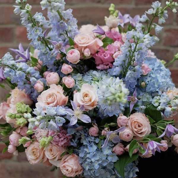 Soft Shabby chic baby love ,blue delphiniums and pink roses.