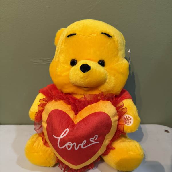 Pooh bear with love heart
