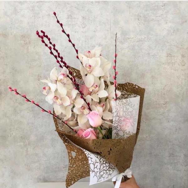 Cymbidium orchid with roses